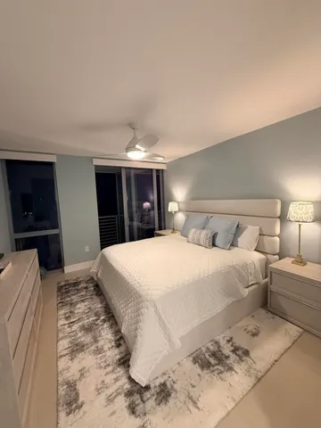 a bathroom with a bathtub sink mirror and toilet