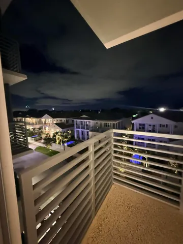 a view of a swimming pool with outdoor seating