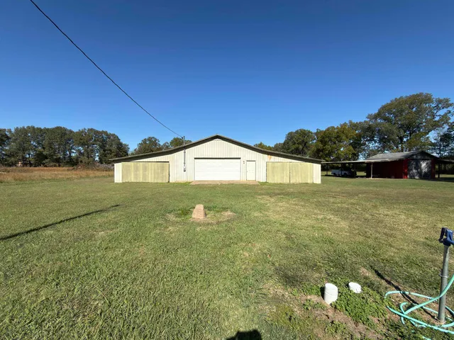 a view of front of house with a yard