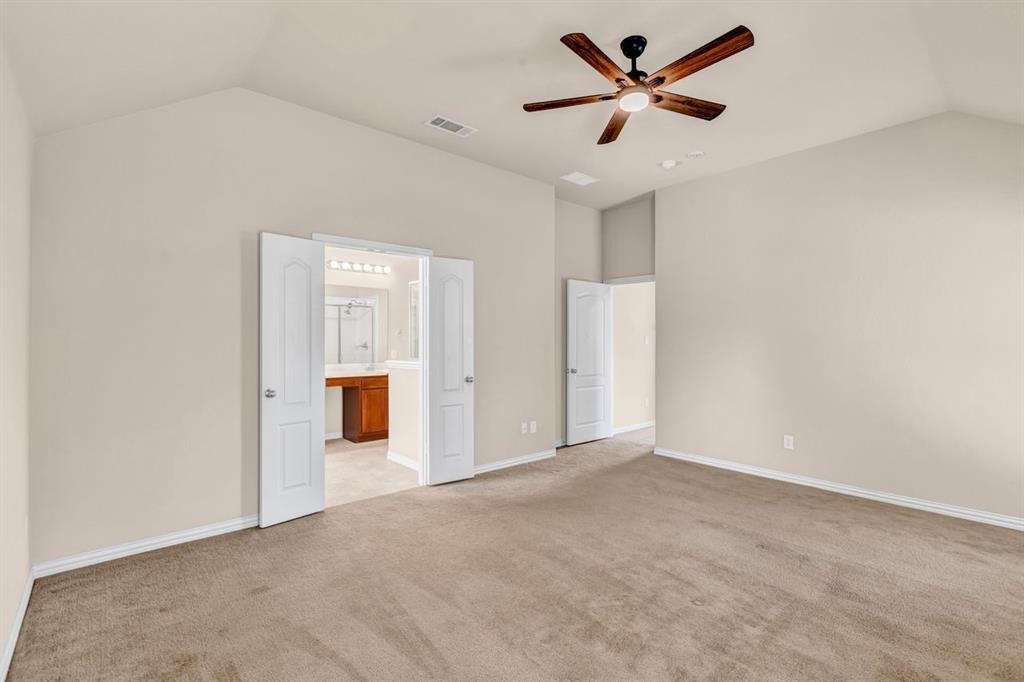 5316 Ridgeson Drive McKinney, TX 75071 - Photo 21 of 33 Vaulted ceiling room featuring carpet flooring and a multi-blade ceiling fan