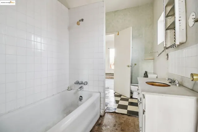 a bathroom with a sink a toilet and window