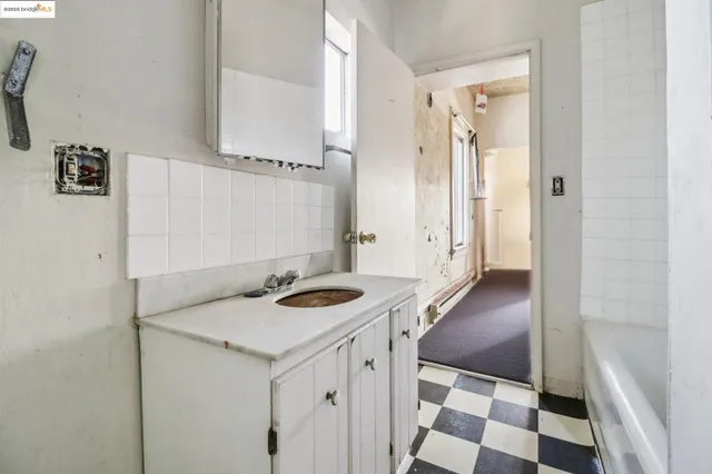 a view of a yard with wooden fence