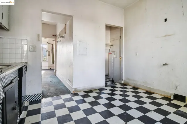 a view of a storage & utility room with a washing machine