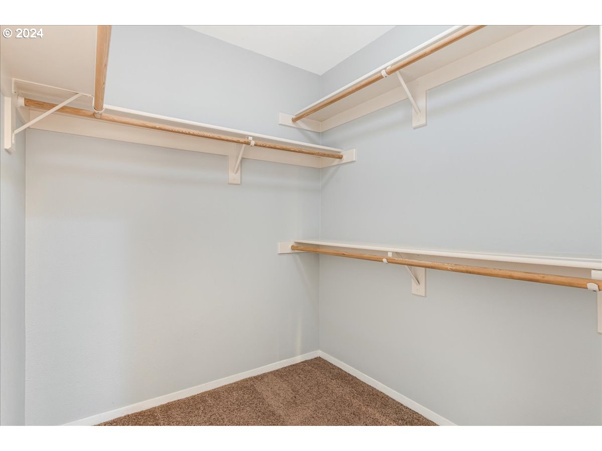 5225 Jean Road, Unit 313 Lake Oswego, OR 97035 - Photo 18 of 32 a view of a room with racks on the wall