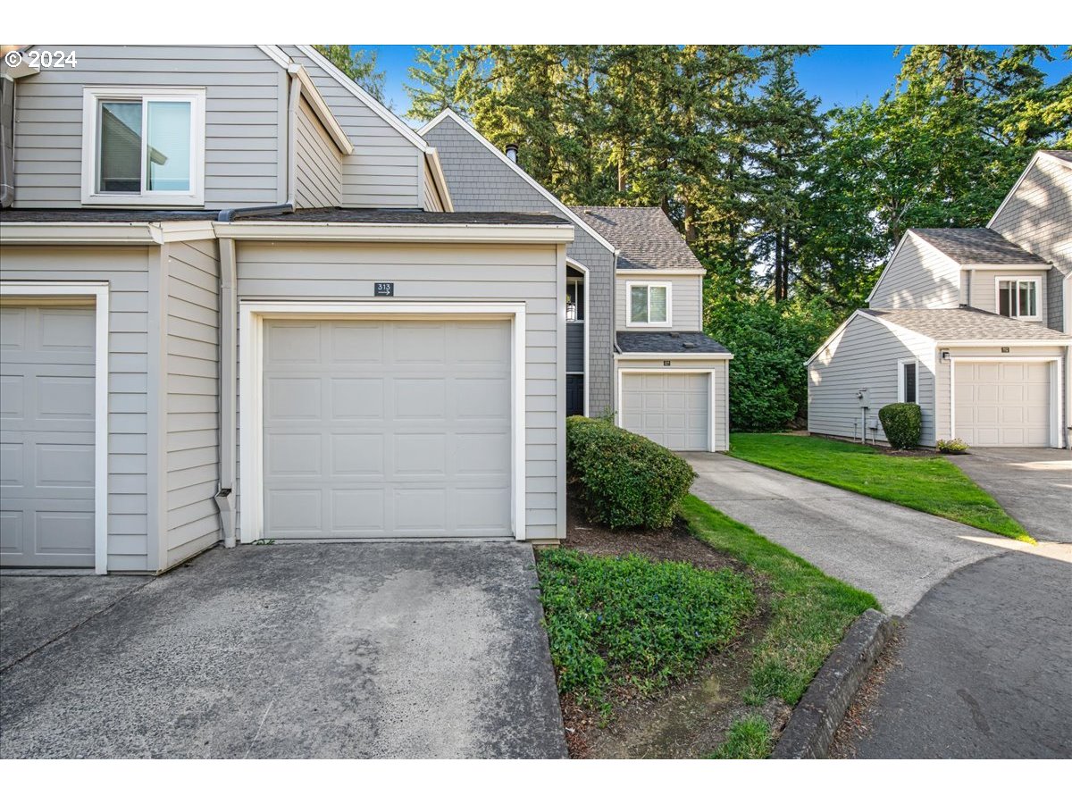 5225 Jean Road, Unit 313 Lake Oswego, OR 97035 - Photo 2 of 32 a view of a house with a yard