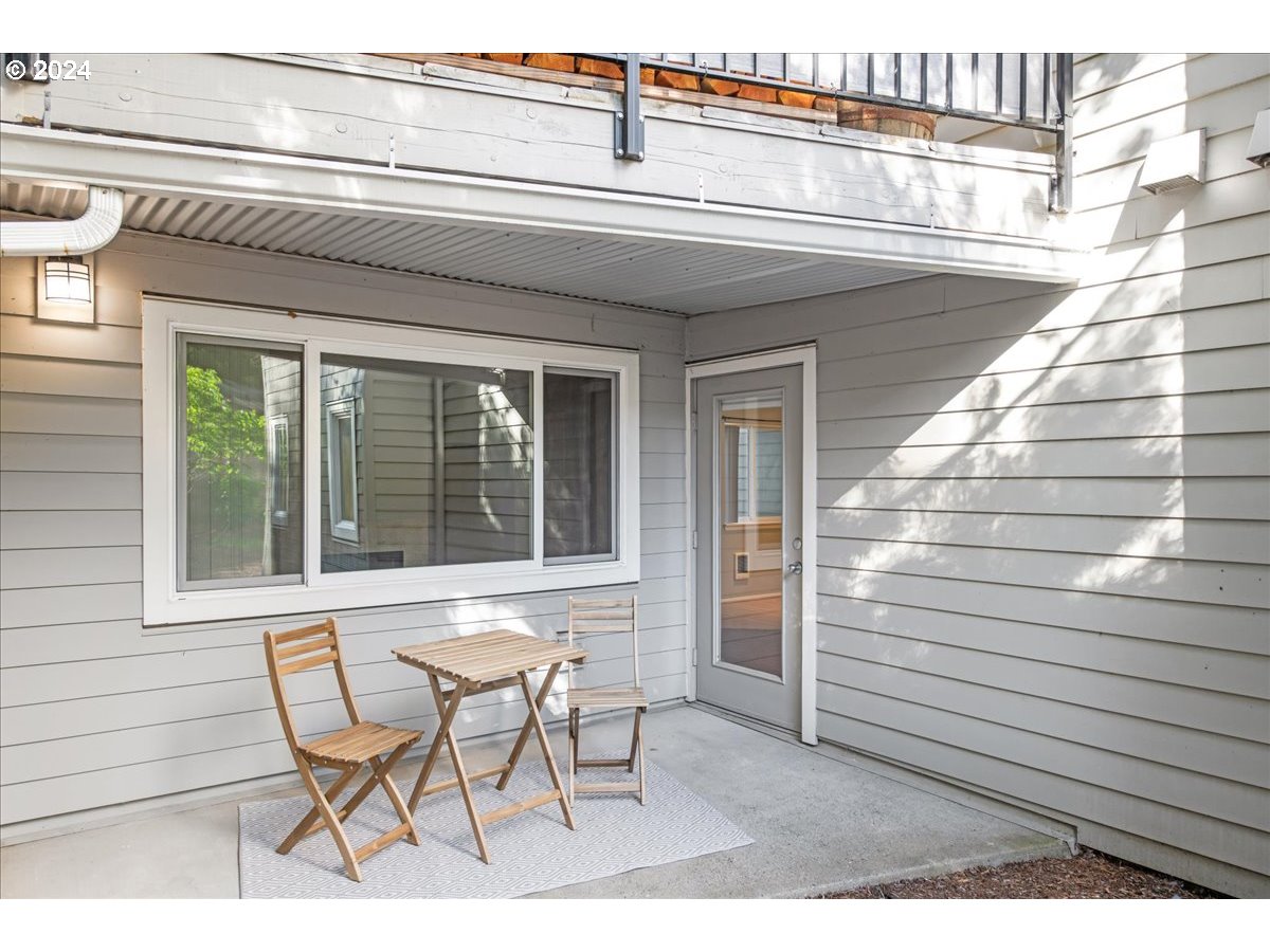 5225 Jean Road, Unit 313 Lake Oswego, OR 97035 - Photo 25 of 32 a view of a chair and table in the balcony