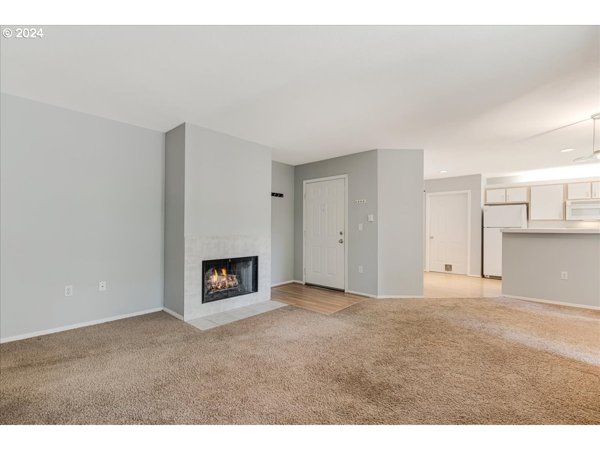 5225 Jean Road, Unit 313 Lake Oswego, OR 97035 - Photo 3 of 32 a view of an empty room with a fireplace