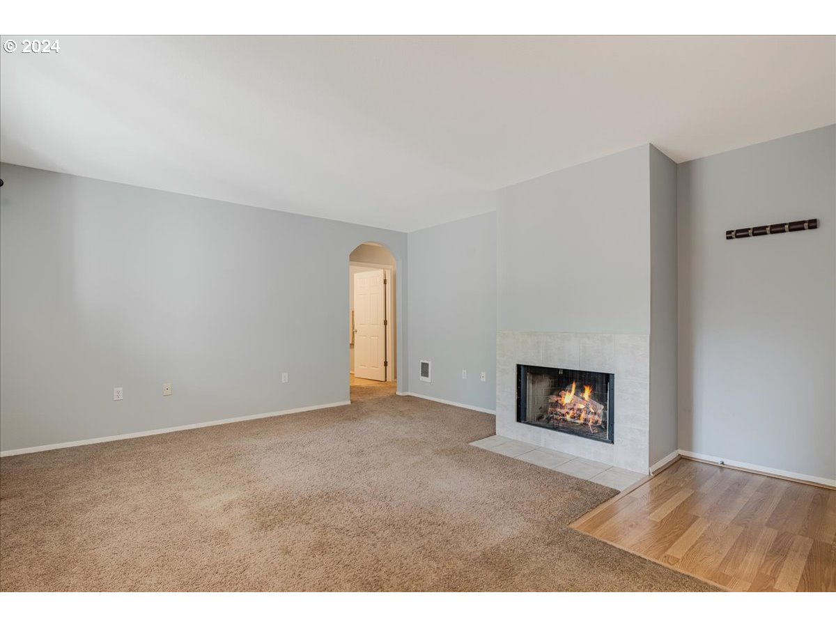 5225 Jean Road, Unit 313 Lake Oswego, OR 97035 - Photo 4 of 32 a view of an empty room with a fireplace