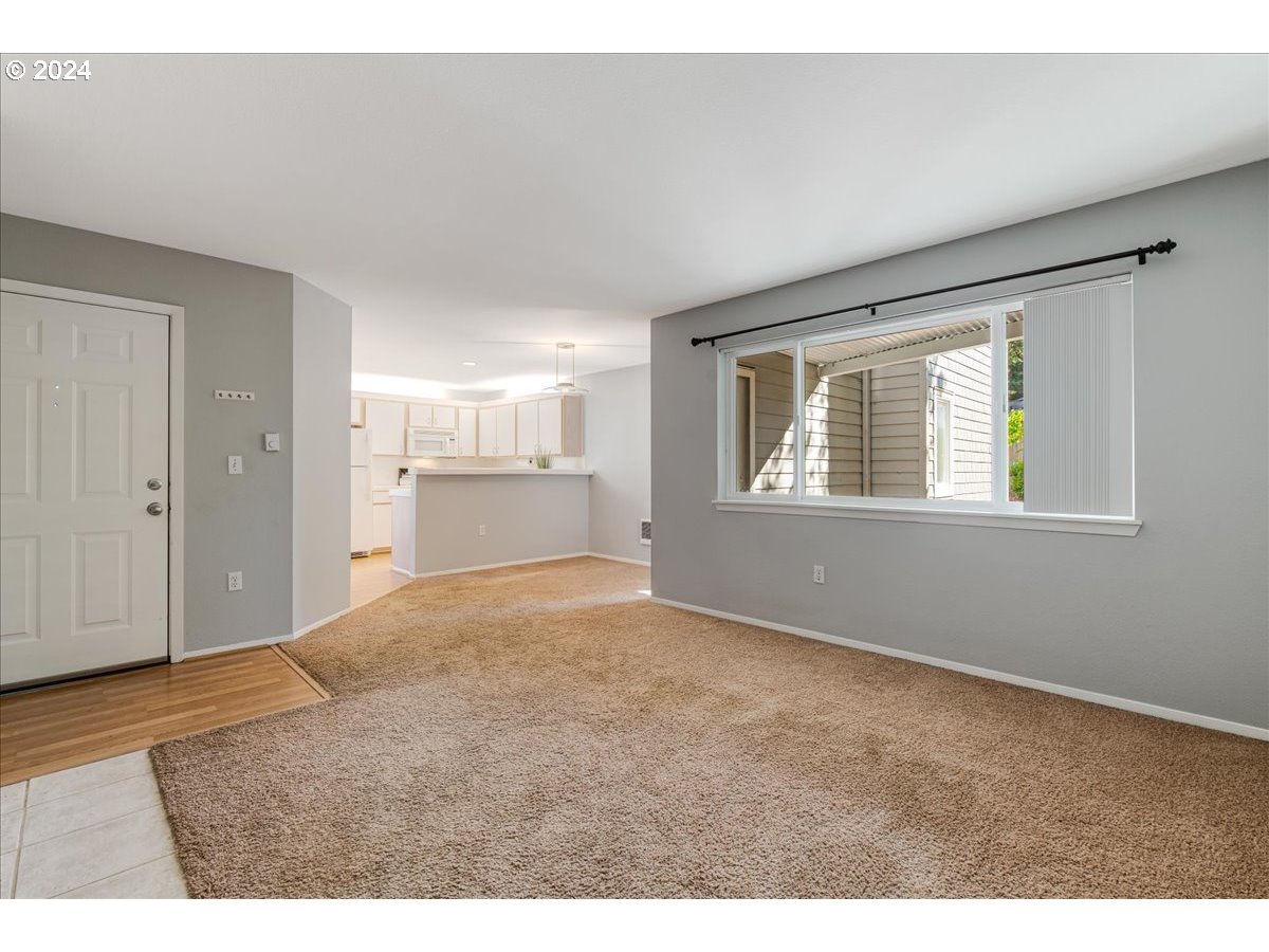 5225 Jean Road, Unit 313 Lake Oswego, OR 97035 - Photo 7 of 32 a view of an empty room with a window