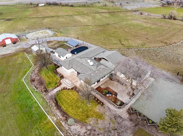 an aerial view of a house with a ocean view