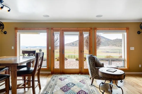 a living room with fireplace furniture and decor