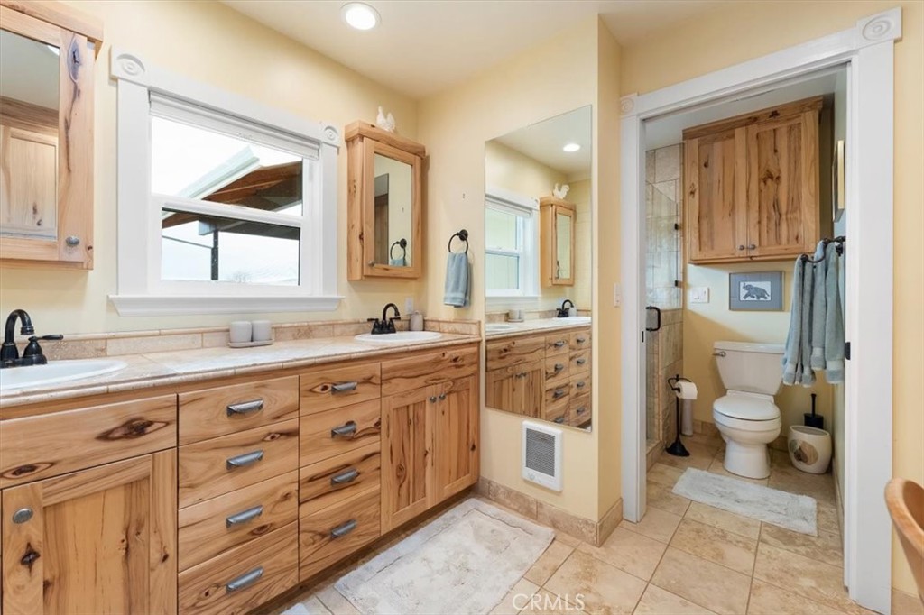 1201 Ball Mountain Little Shasta Road Montague, CA 96064 - Photo 22 of 46 a spacious bathroom with a granite countertop sink mirror and a toilet