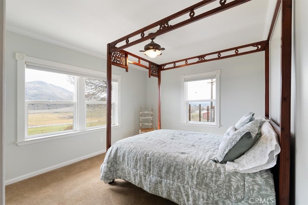 1201 Ball Mountain Little Shasta Road Montague, CA 96064 - Photo 27 of 46 a bed sitting in a bedroom next to a window