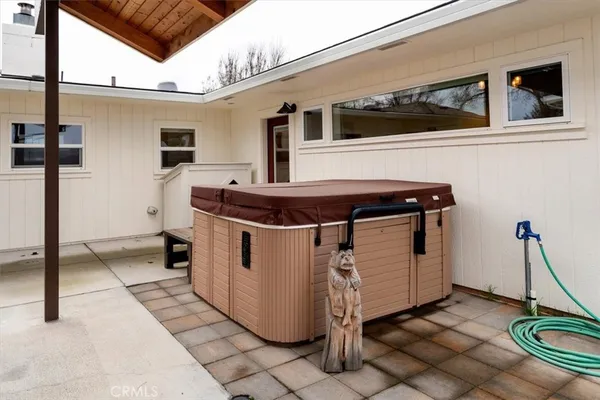 a view of a house with a wooden deck