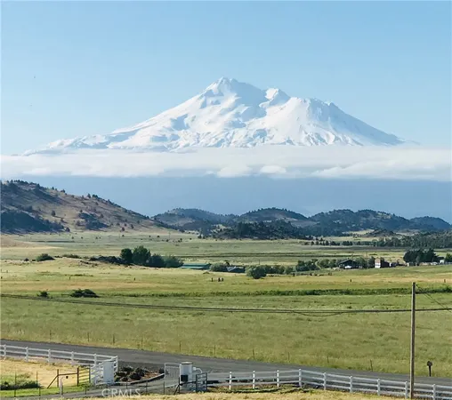 a kitchen with stainless steel appliances granite countertop a stove and a refrigerator