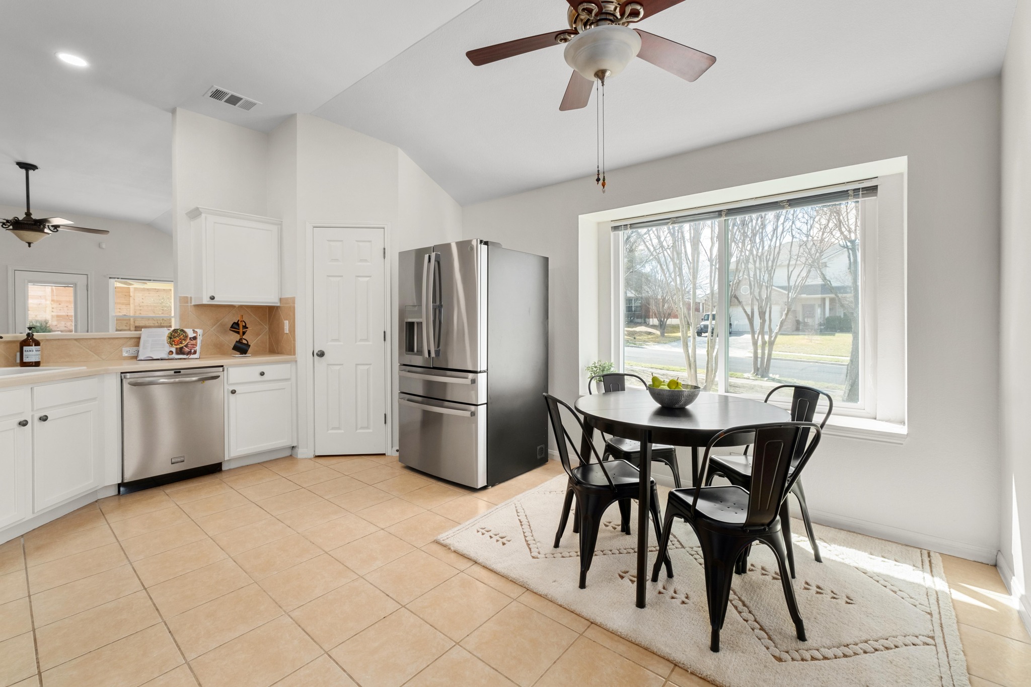 100 Pecanwood South Kyle, TX 78640 - Photo 17 of 35 Tucked just off the main kitchen workspace, the breakfast area offers a comfortable everyday dining space that keeps mornings and weeknight meals simple and convenient