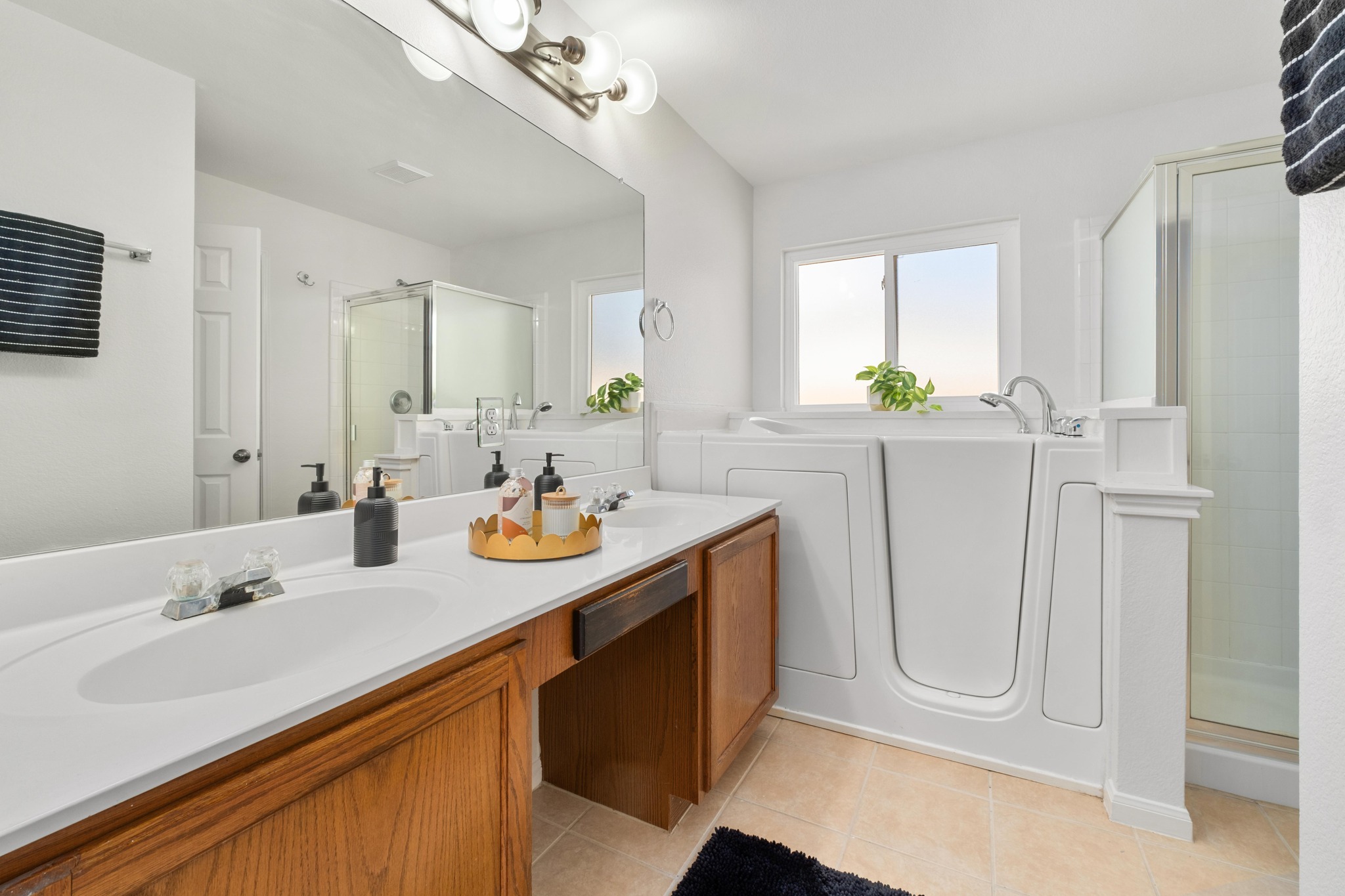 100 Pecanwood South Kyle, TX 78640 - Photo 19 of 35 The primary bathroom features a dual vanity that provides plenty of counter space, making the morning routine a little easier with room for everything in its place