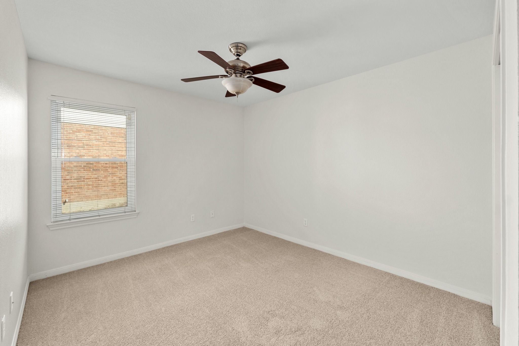 100 Pecanwood South Kyle, TX 78640 - Photo 24 of 35 Each bedroom features brand new carpet, a ceiling fan and freshly painted, neutral toned walls