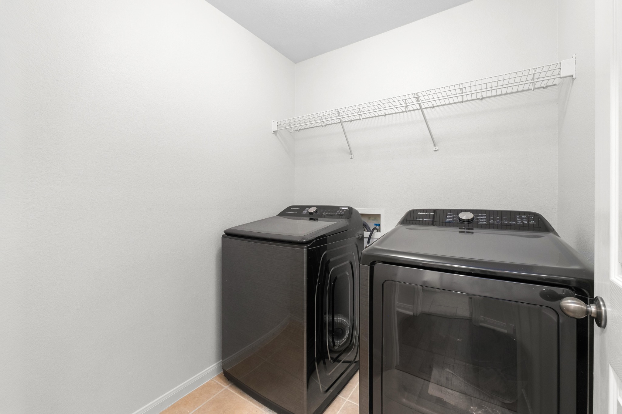100 Pecanwood South Kyle, TX 78640 - Photo 29 of 35 Spacious laundry room with a built-in shelf for additional storage