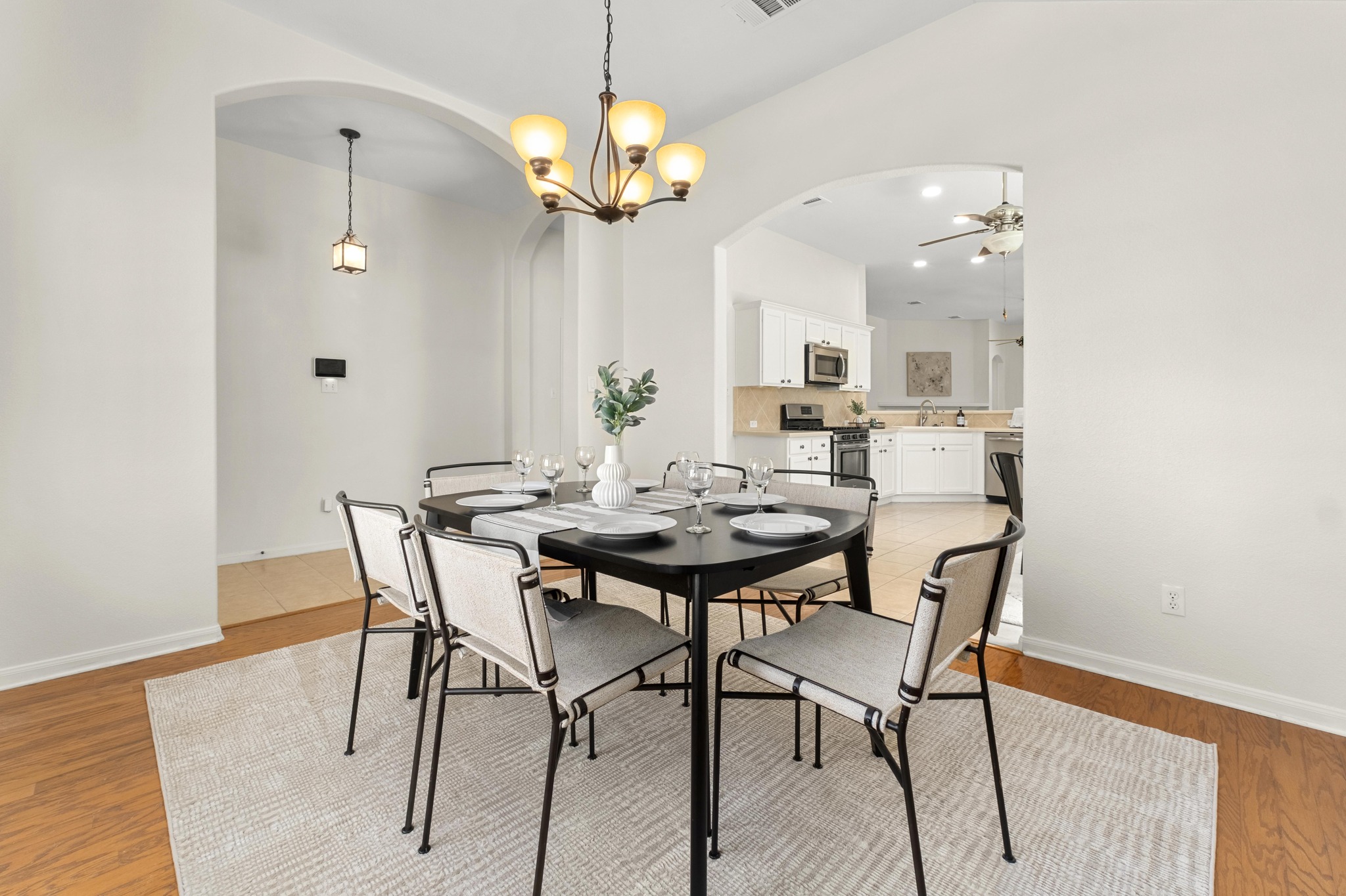 100 Pecanwood South Kyle, TX 78640 - Photo 3 of 35 Positioned just off the entry, the formal dining room welcomes you into the home with an open, comfortable space that connects directly to the kitchen, making it easy to move from preparing meals to gathering around the table