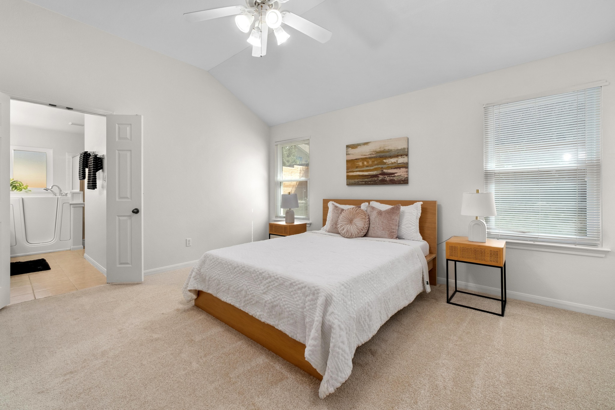 100 Pecanwood South Kyle, TX 78640 - Photo 4 of 35 The primary bedroom offers generous space with room for a sitting area, creating a comfortable spot to start the morning or unwind at the end of the day