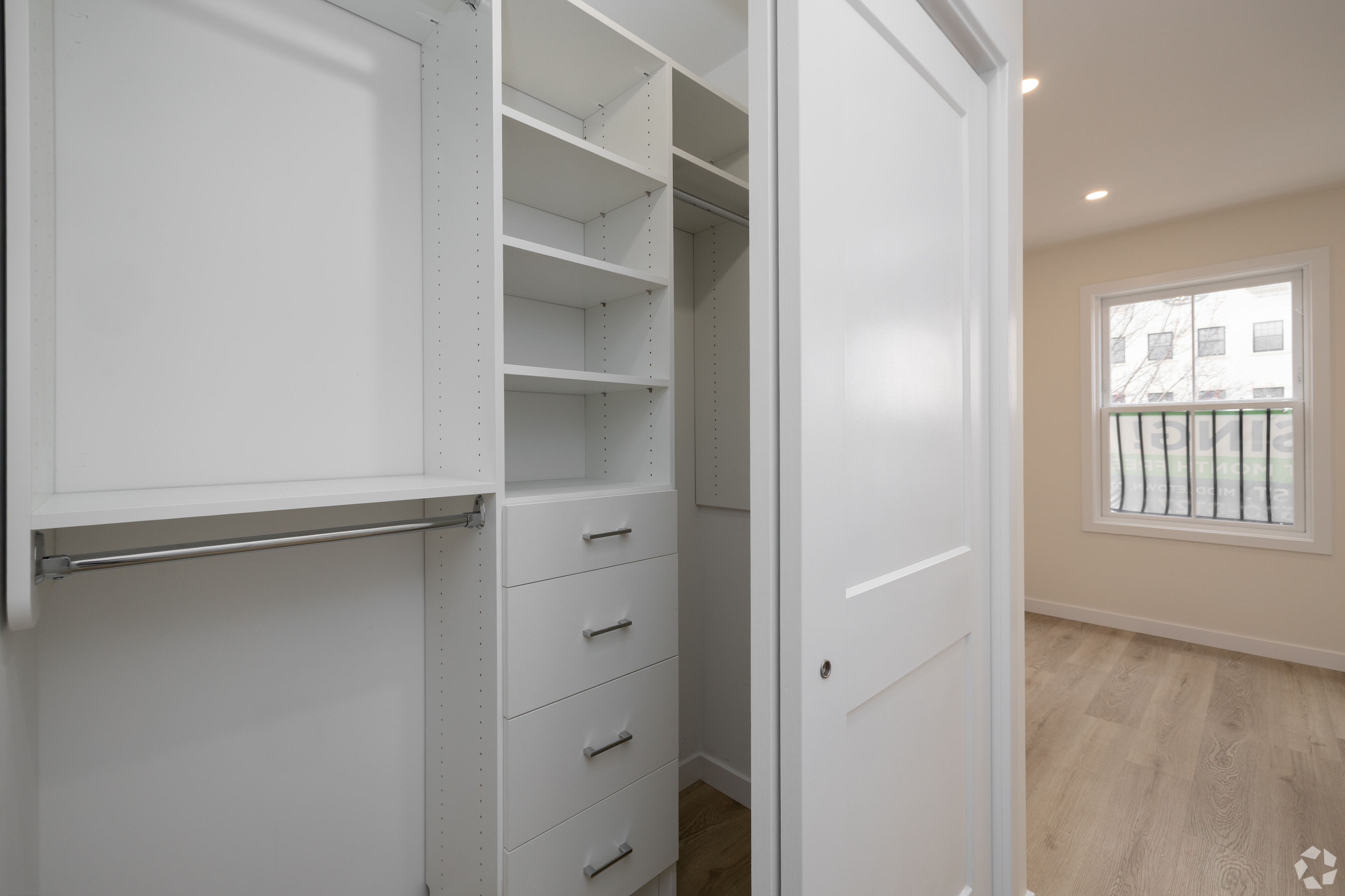 584 Main Street, Unit H Middletown, CT 06457 - Photo 4 of 10 a view of walk in closet with empty racks