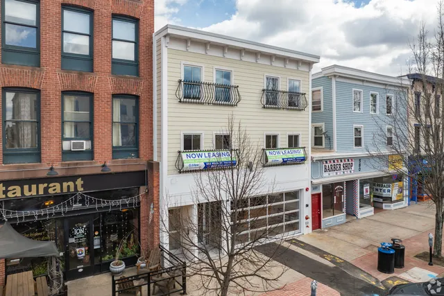 a front view of a building with glass windows