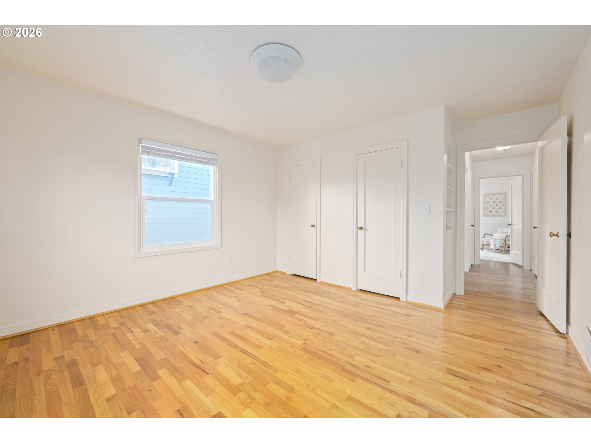 2031 Olive Street Eugene, OR 97405 - Photo 18 of 38 a view of an empty room with wooden floor