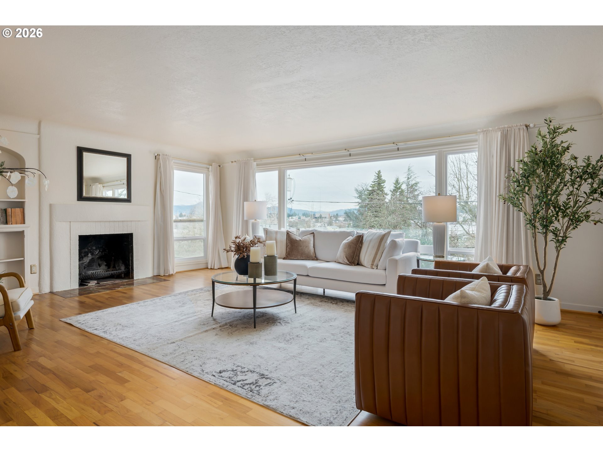 2031 Olive Street Eugene, OR 97405 - Photo 3 of 38 a living room with furniture and a fireplace