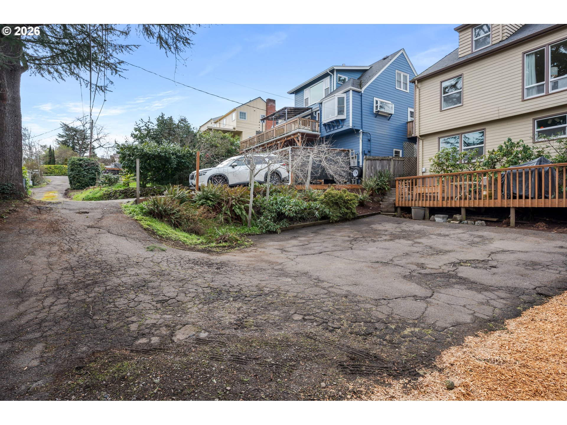 2031 Olive Street Eugene, OR 97405 - Photo 35 of 38 a view of a house with a yard and potted plants