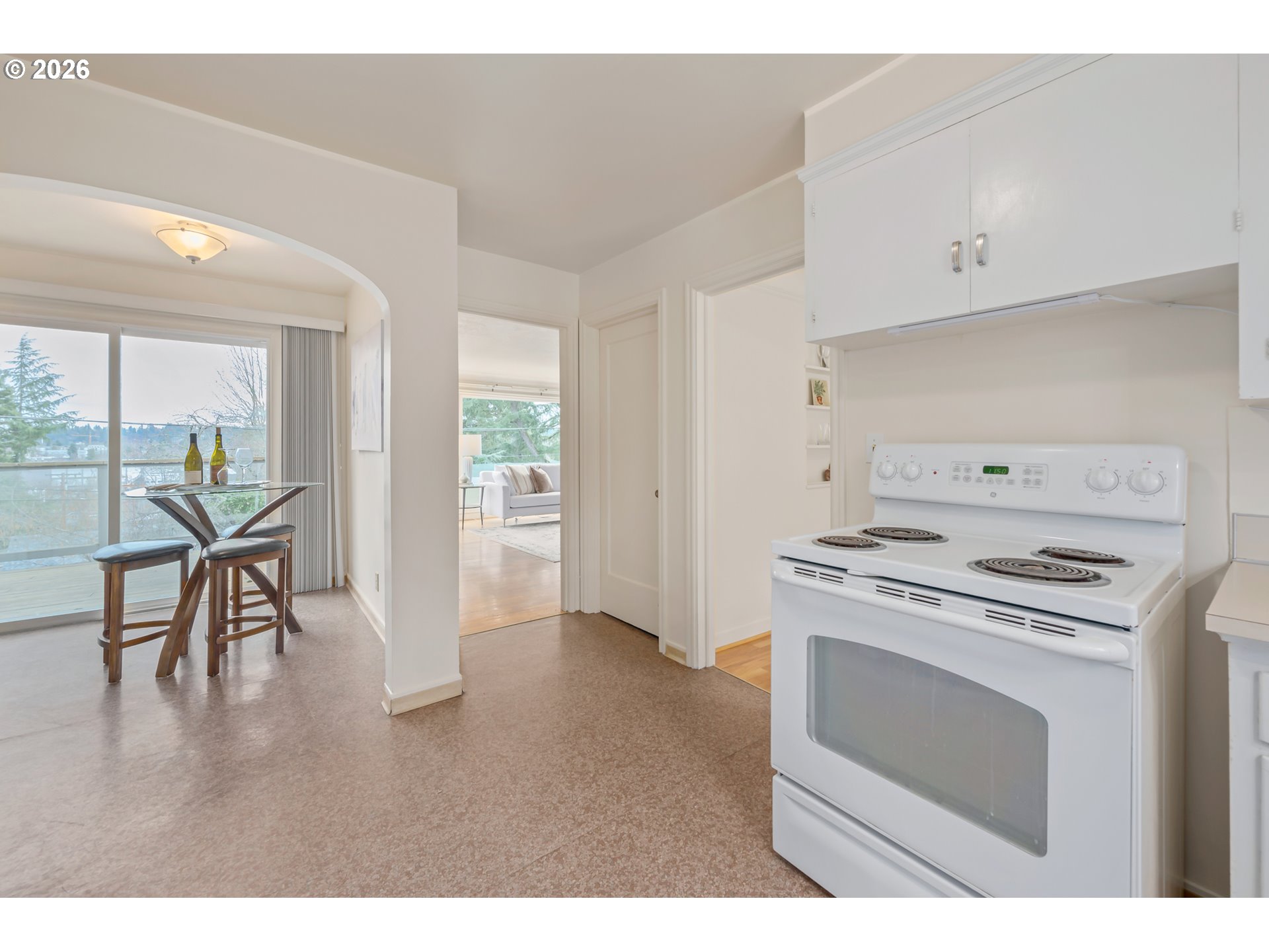 2031 Olive Street Eugene, OR 97405 - Photo 10 of 38 a kitchen with a stove a refrigerator and a table