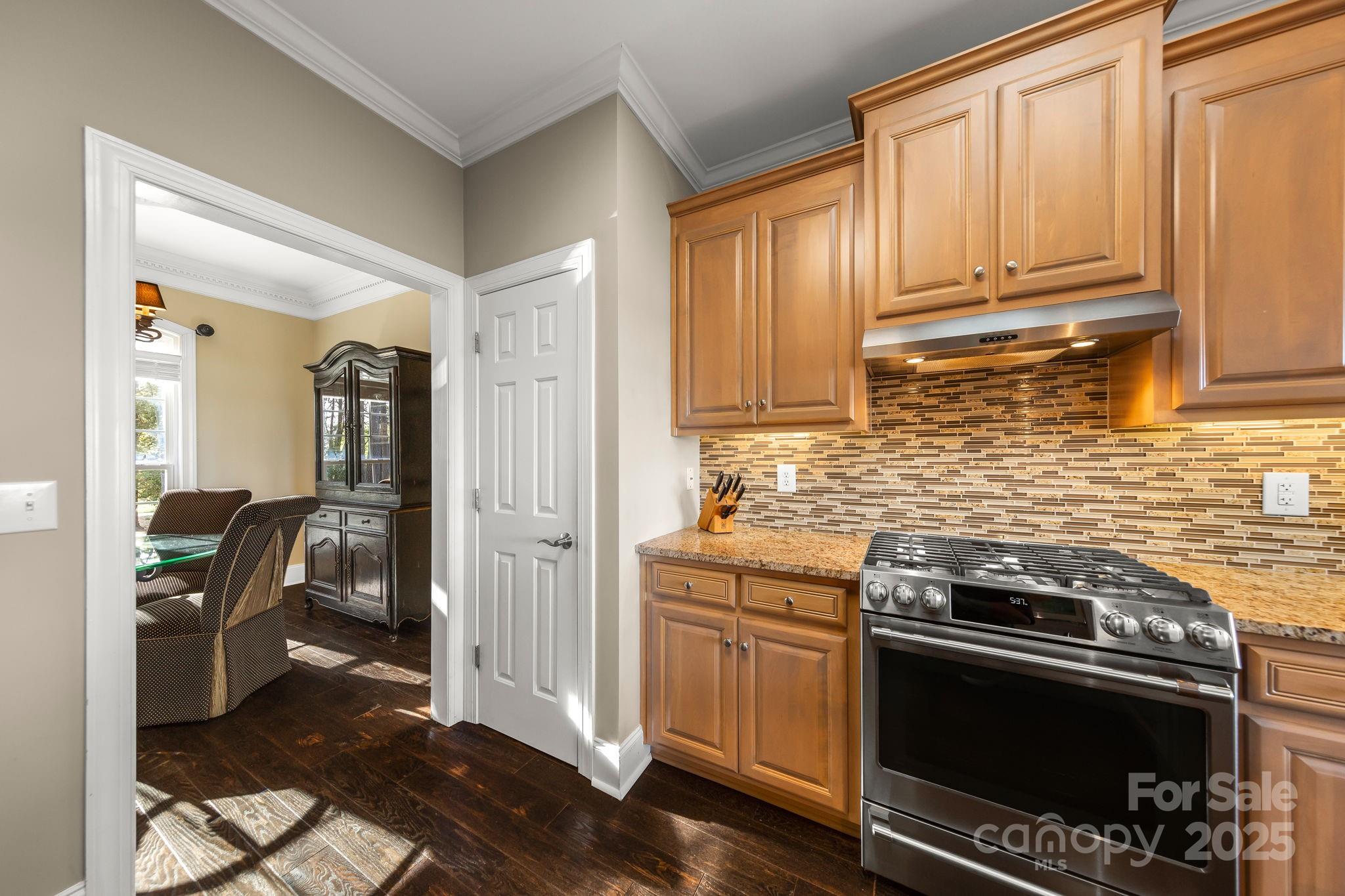 796 Lake Mist Drive Stanley, NC 28164 - Photo 15 of 43 a kitchen with a stove and a refrigerator