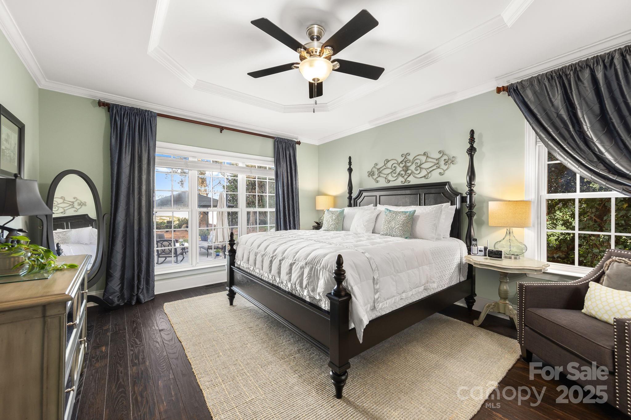 796 Lake Mist Drive Stanley, NC 28164 - Photo 17 of 43 a bedroom with a bed couch and a large window