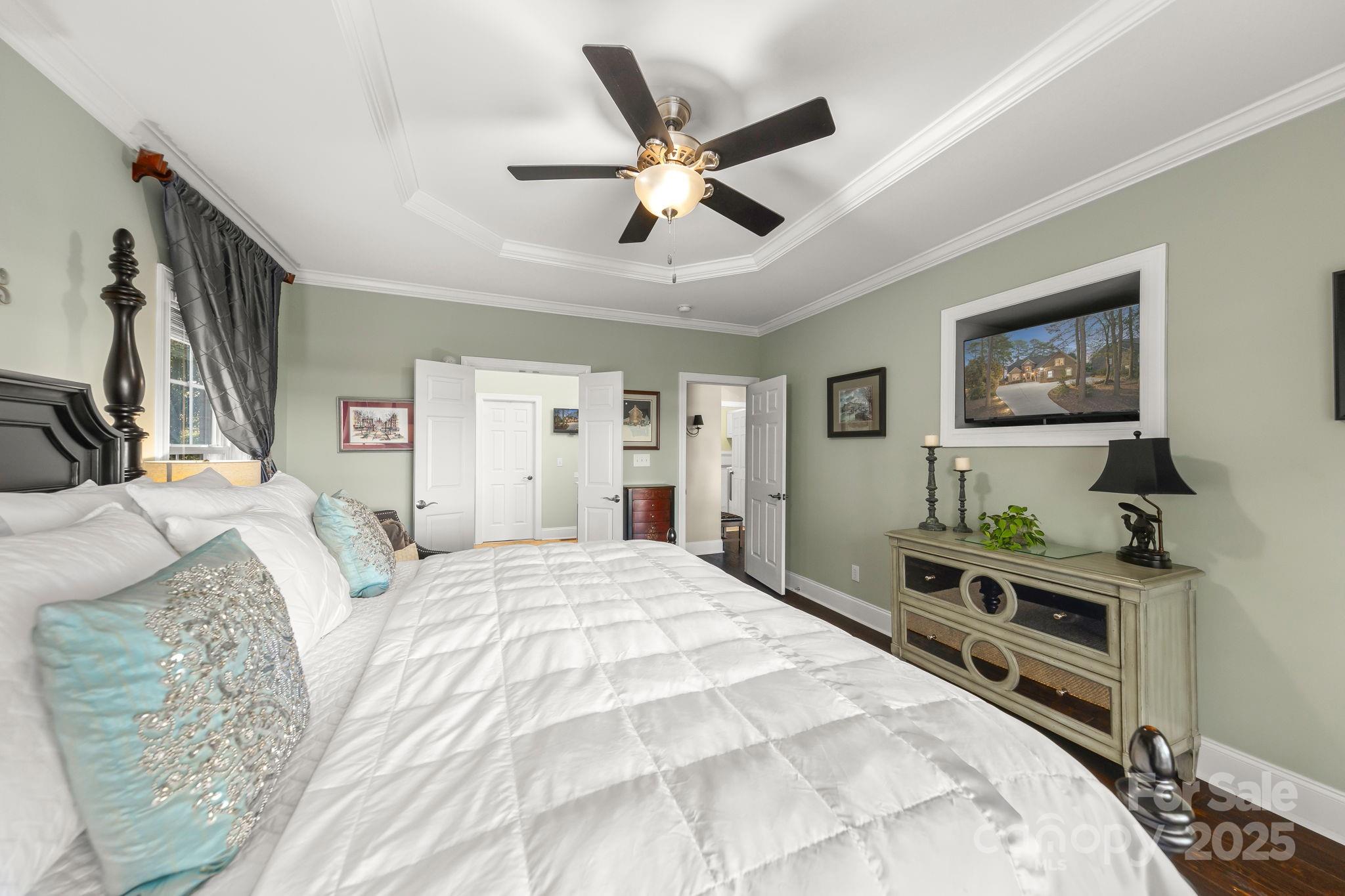 796 Lake Mist Drive Stanley, NC 28164 - Photo 18 of 43 a bed room with a bed and a flat screen tv