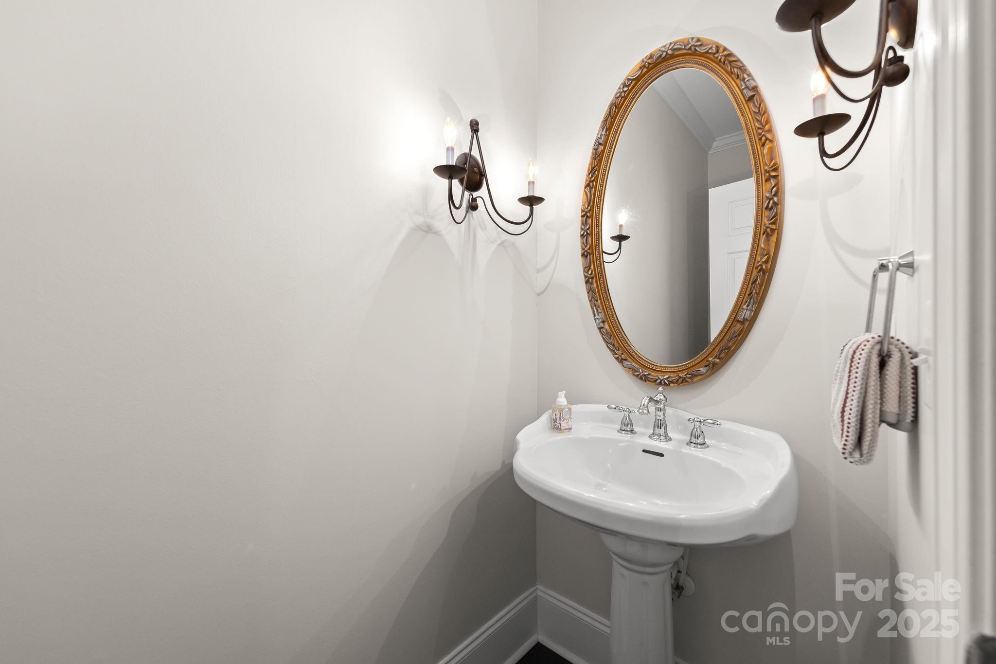796 Lake Mist Drive Stanley, NC 28164 - Photo 22 of 43 a bathroom with a sink and a mirror