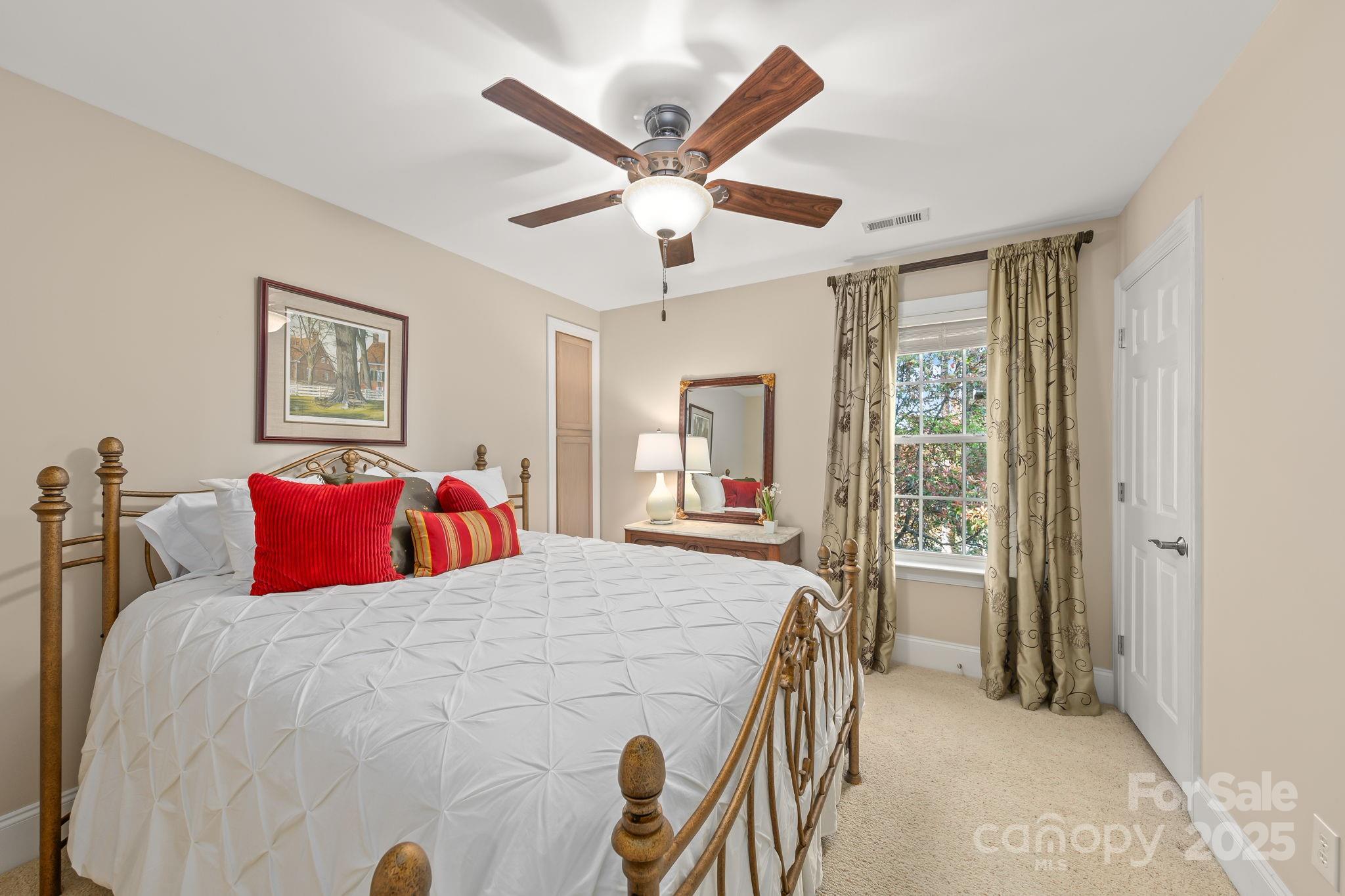 796 Lake Mist Drive Stanley, NC 28164 - Photo 23 of 43 a bed room with a bed and a large window