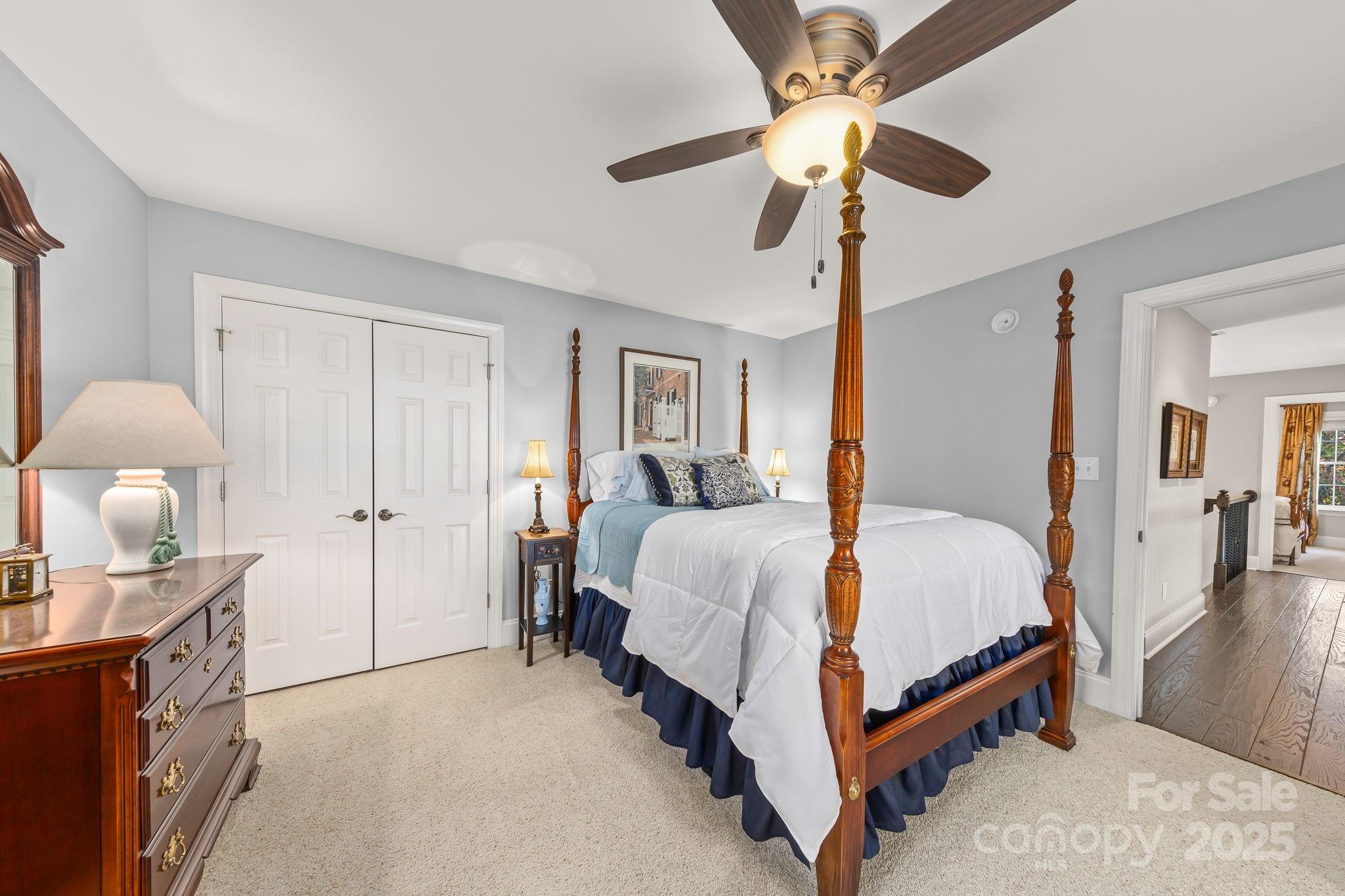 796 Lake Mist Drive Stanley, NC 28164 - Photo 25 of 43 a bed room with a bed and a chandelier