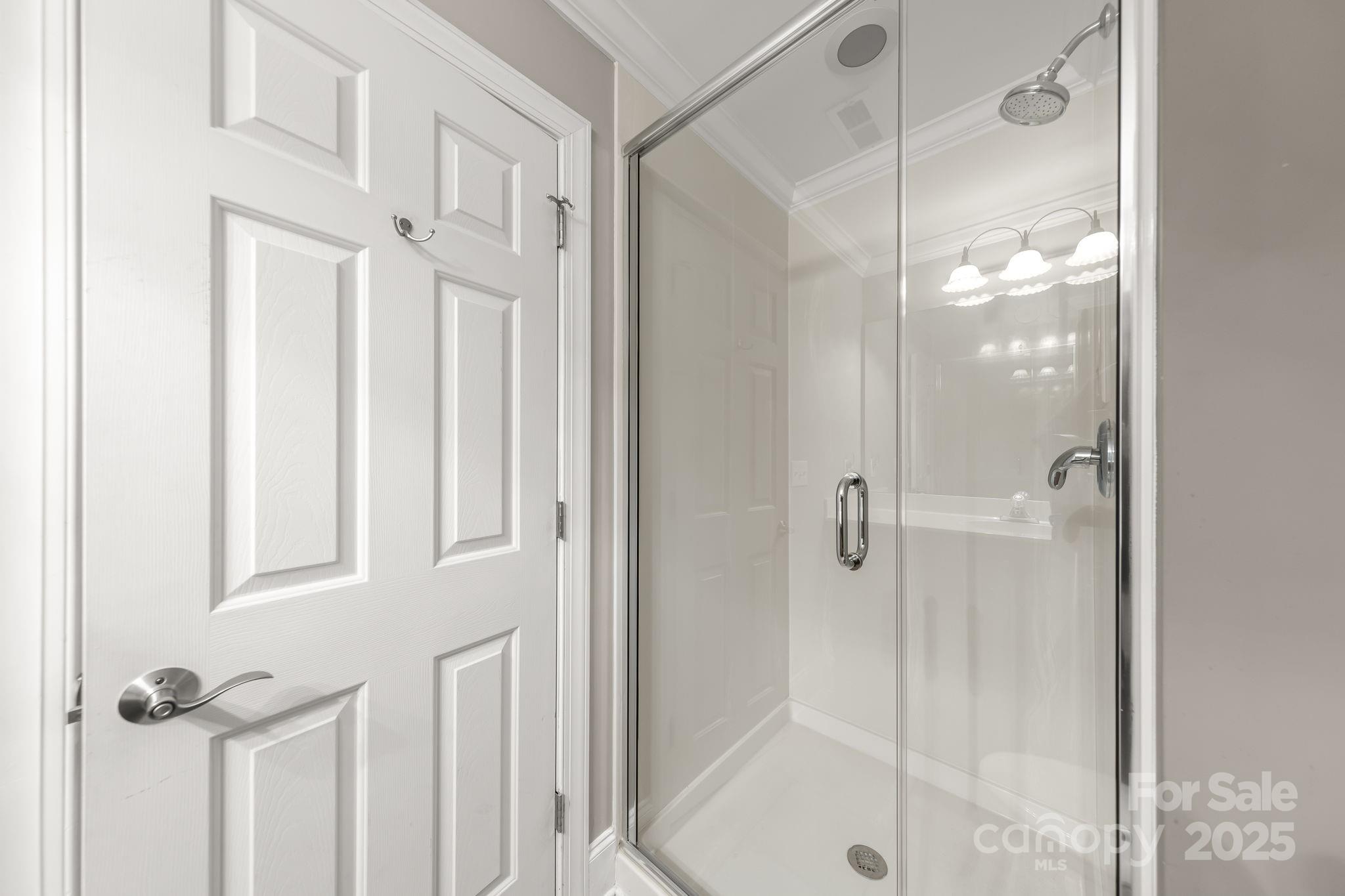 796 Lake Mist Drive Stanley, NC 28164 - Photo 29 of 43 a bathroom with a glass shower door