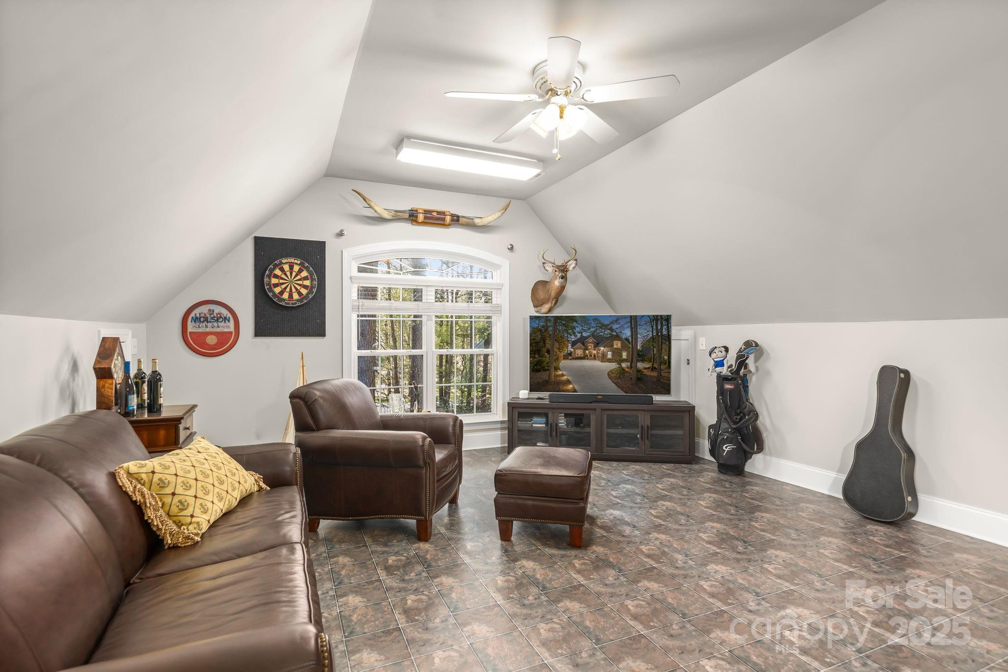 796 Lake Mist Drive Stanley, NC 28164 - Photo 31 of 43 a living room with furniture and a flat screen tv