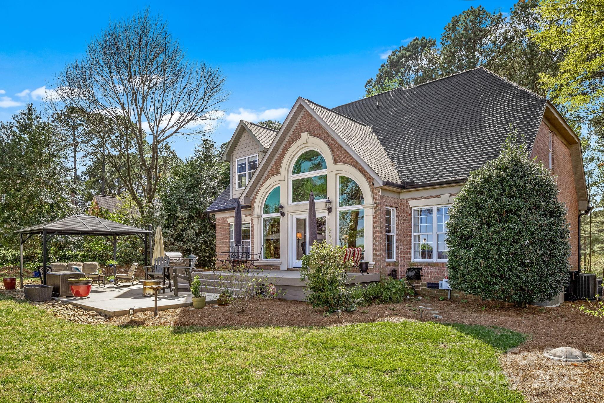 796 Lake Mist Drive Stanley, NC 28164 - Photo 33 of 43 a view of a house with patio and a yard