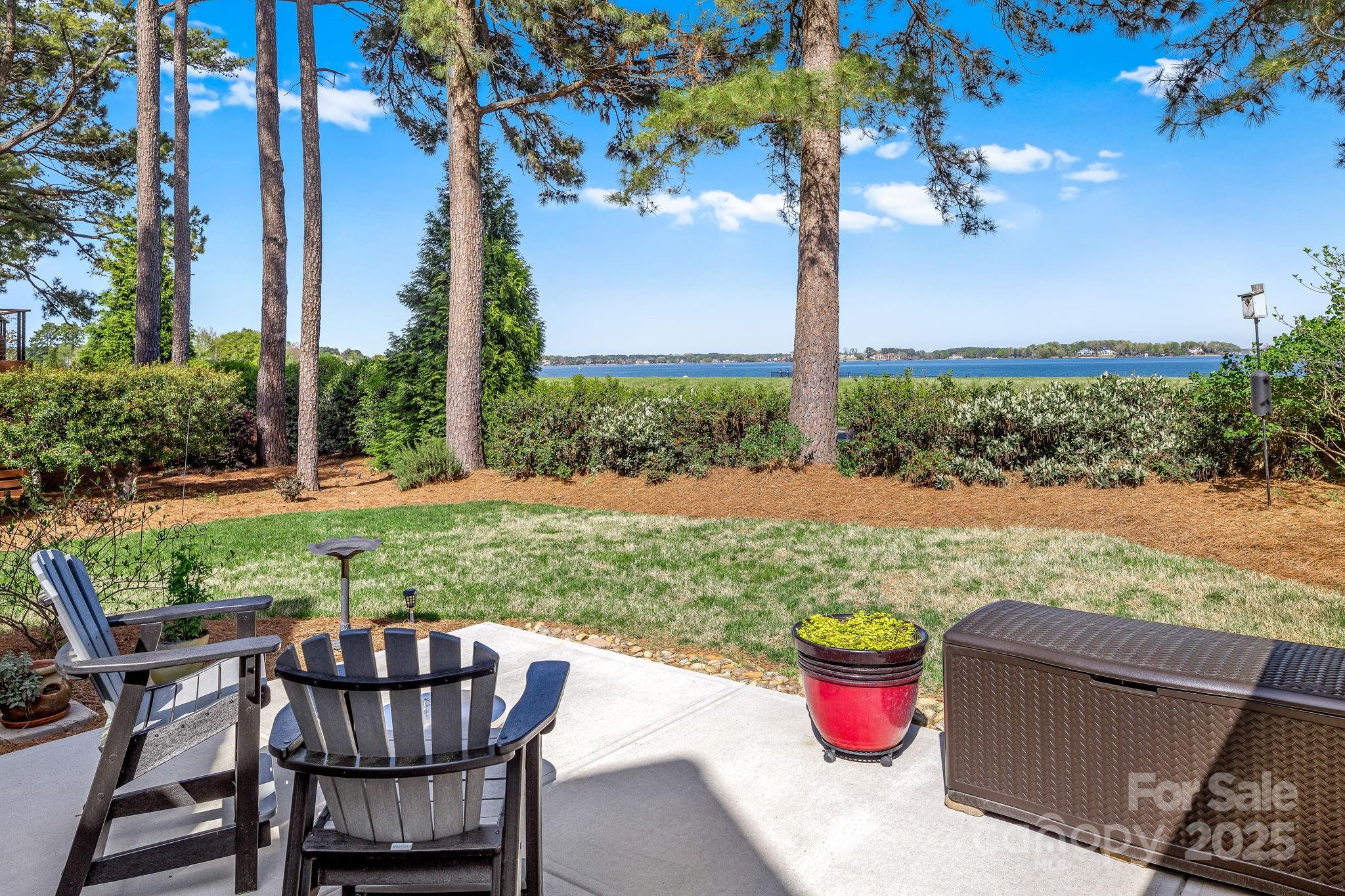 796 Lake Mist Drive Stanley, NC 28164 - Photo 35 of 43 a view of a backyard with sitting area and garden