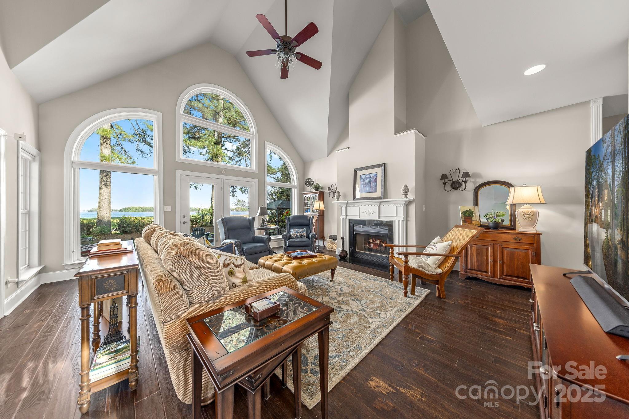 796 Lake Mist Drive Stanley, NC 28164 - Photo 6 of 43 a living room with furniture a fireplace and a large window