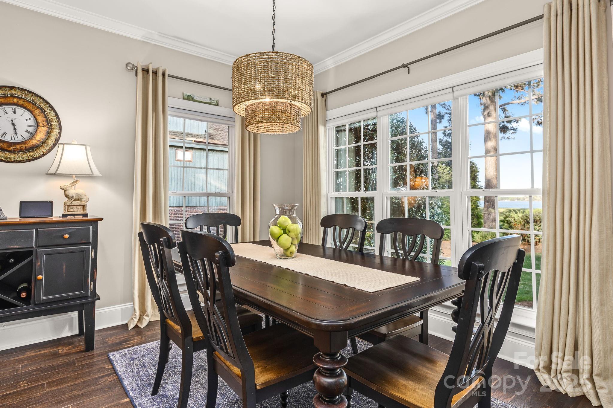 796 Lake Mist Drive Stanley, NC 28164 - Photo 9 of 43 a view of a dining room with furniture window and wooden floor