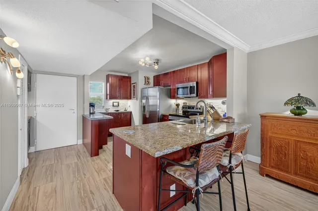 $425,000 | 121 Golden Isles Drive, Unit 205, Hallandale Beach, FL 33009