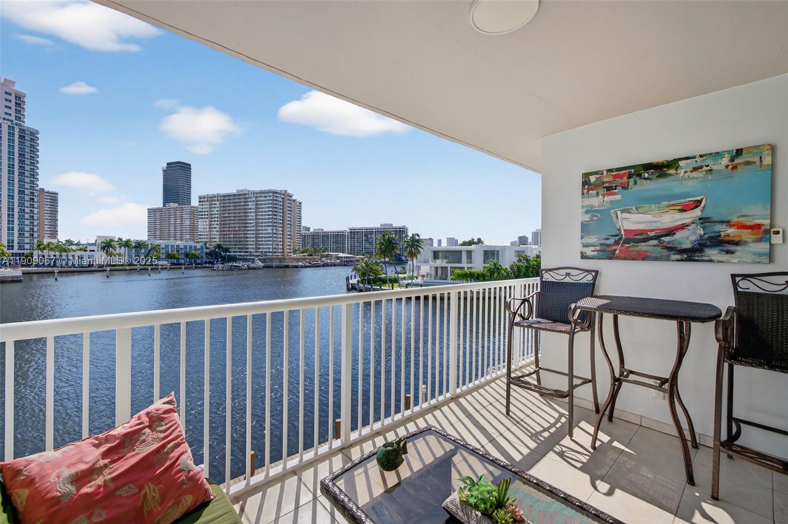 121 Golden Isles Drive, Unit 205 Hallandale Beach, FL 33009 - Photo 19 of 82 a view of a chairs on the roof deck