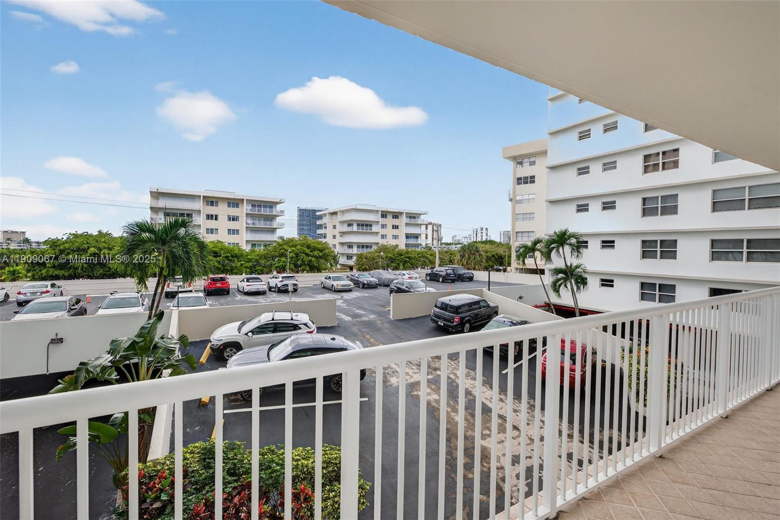 121 Golden Isles Drive, Unit 205 Hallandale Beach, FL 33009 - Photo 22 of 82 a view of a building from a balcony