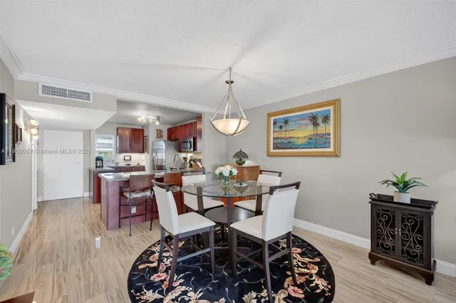 $425,000 | 121 Golden Isles Drive, Unit 205, Hallandale Beach, FL 33009