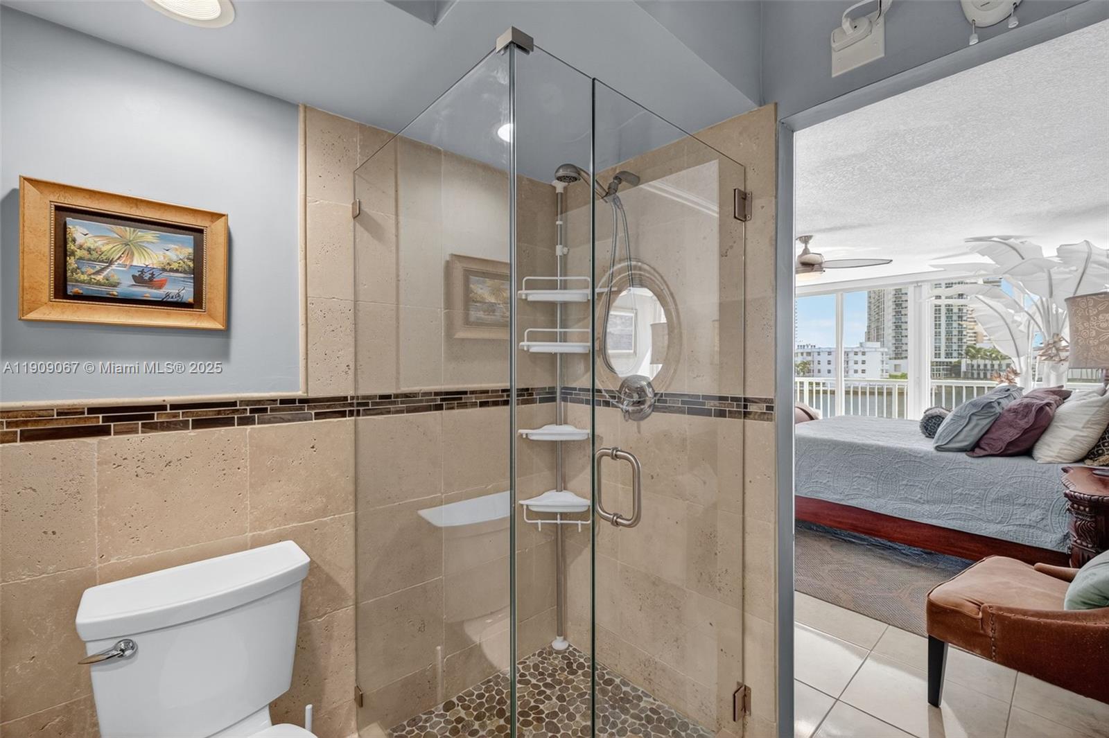 121 Golden Isles Drive, Unit 205 Hallandale Beach, FL 33009 - Photo 35 of 82 a bathroom with a toilet sink and shower