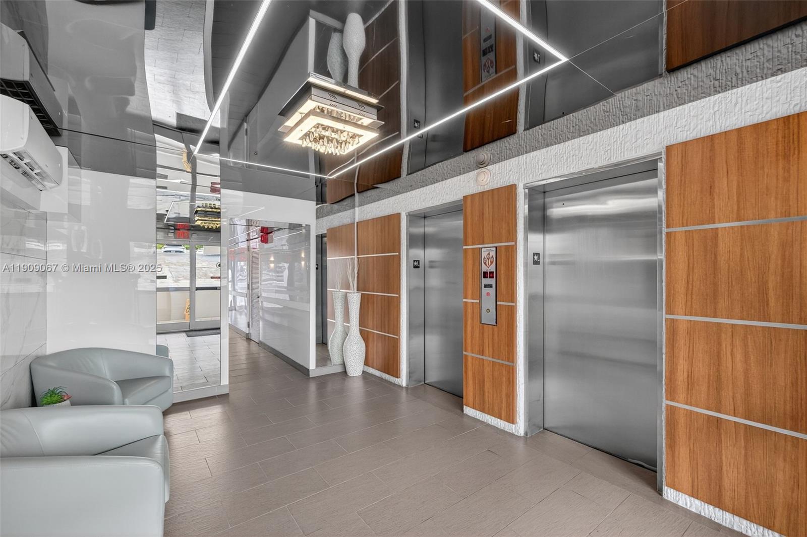 121 Golden Isles Drive, Unit 205 Hallandale Beach, FL 33009 - Photo 41 of 82 a view of livingroom with furniture and wooden floor