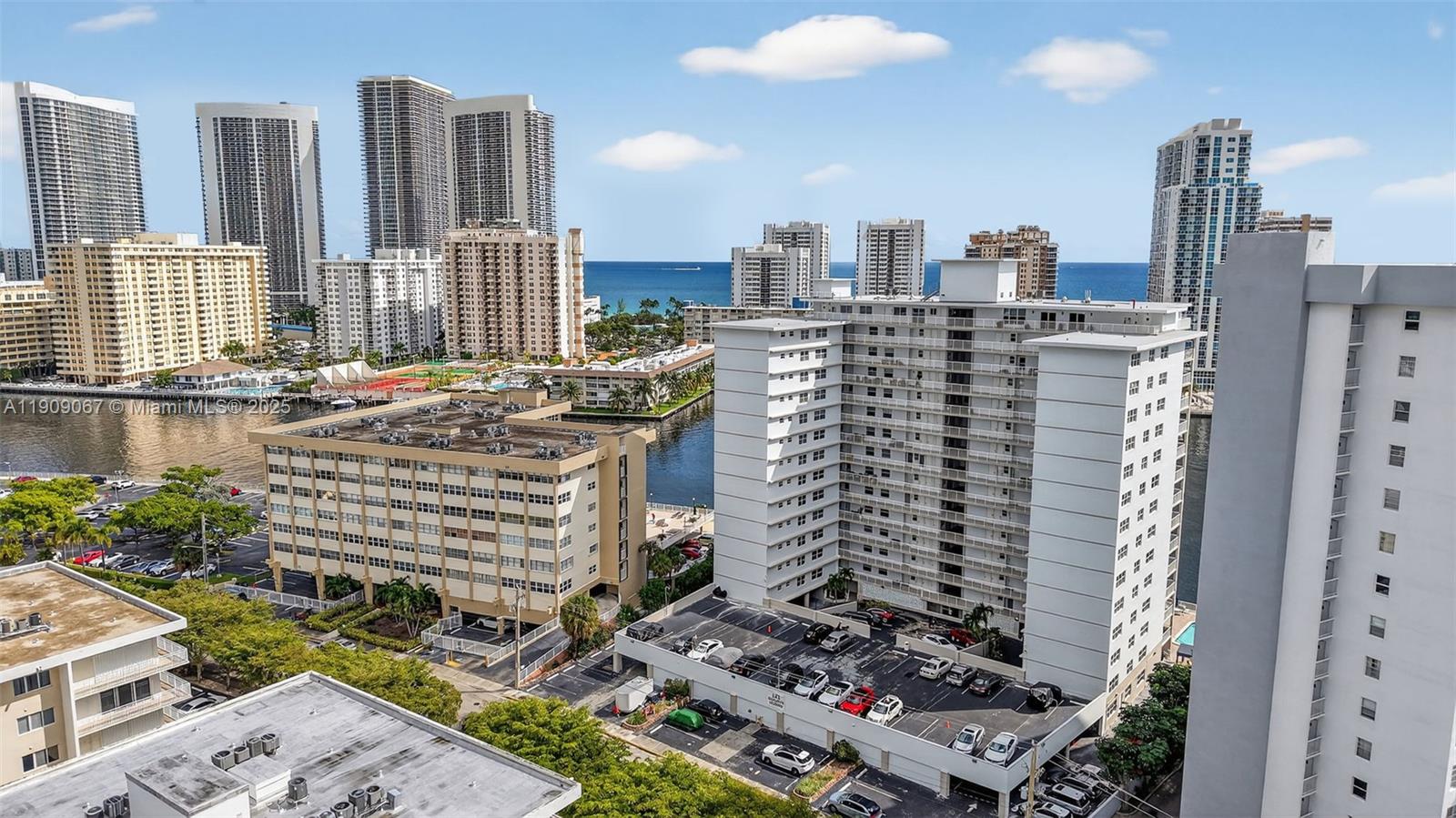 121 Golden Isles Drive, Unit 205 Hallandale Beach, FL 33009 - Photo 53 of 82 a city view with tall buildings